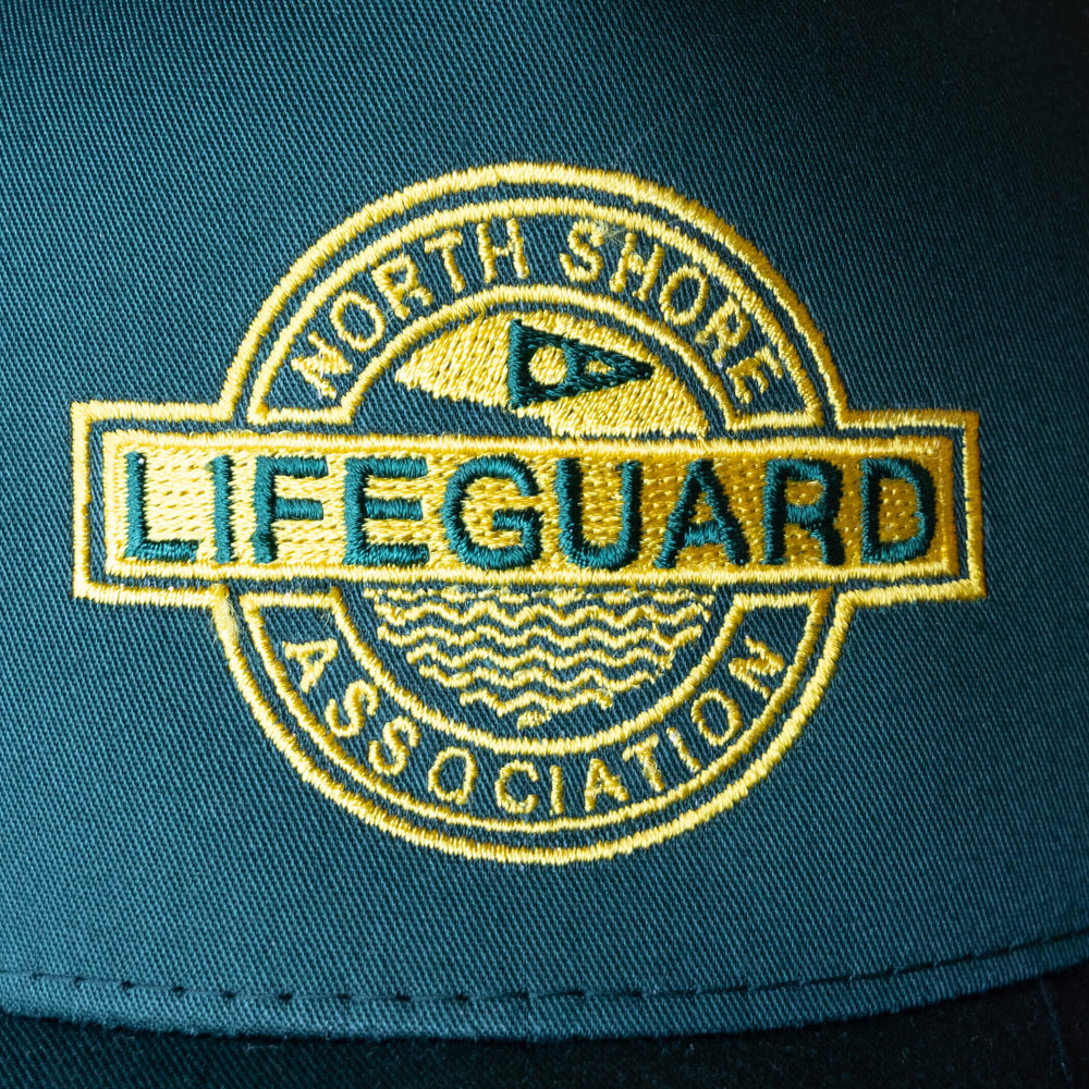 Color:Dark Emerald-North Shore Lifeguard Association Twill Trucker Hat -alt
