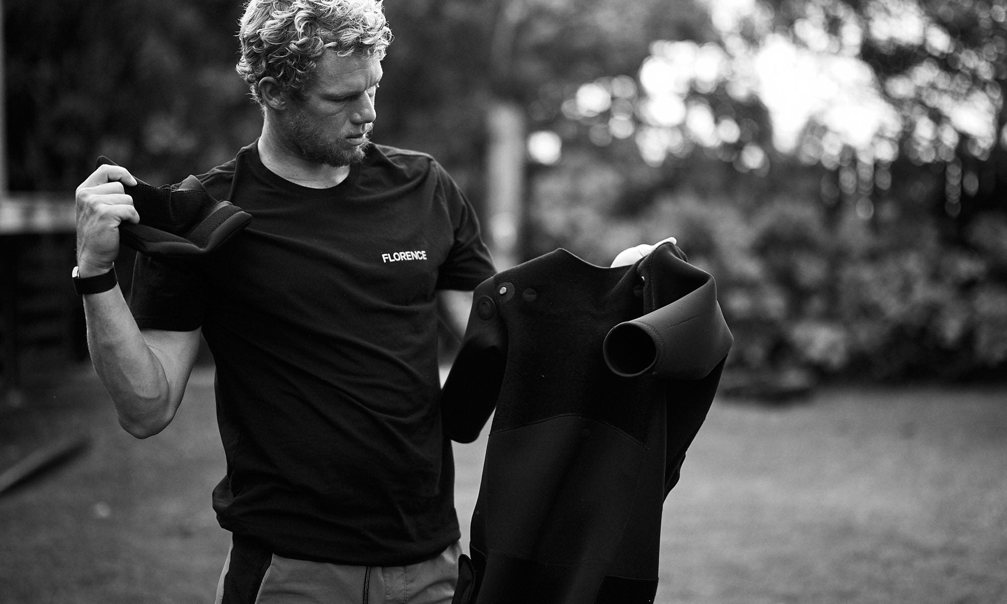 John John Florence adding floatation to his impact wetsuit in a backyard in Hawaii