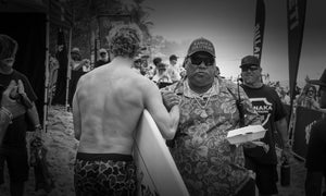 John John Florence shanking hands with locals at Pipeline