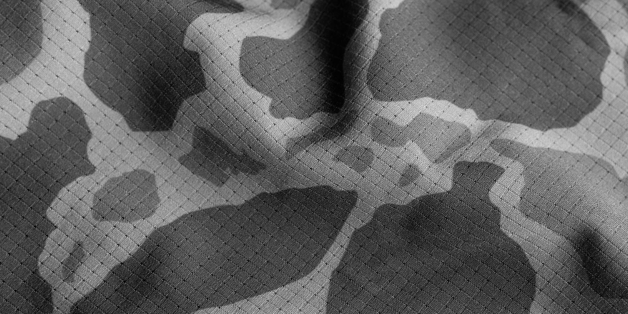 Up close detail photo of the fabric composition of AIRTEX with a camouflage print