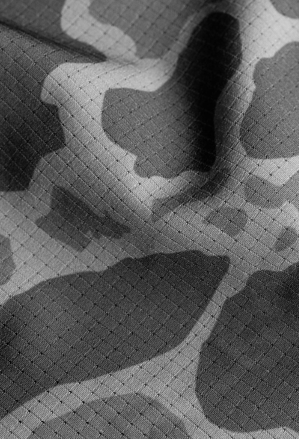 Up close detail photo of the fabric composition of AIRTEX with a camouflage print