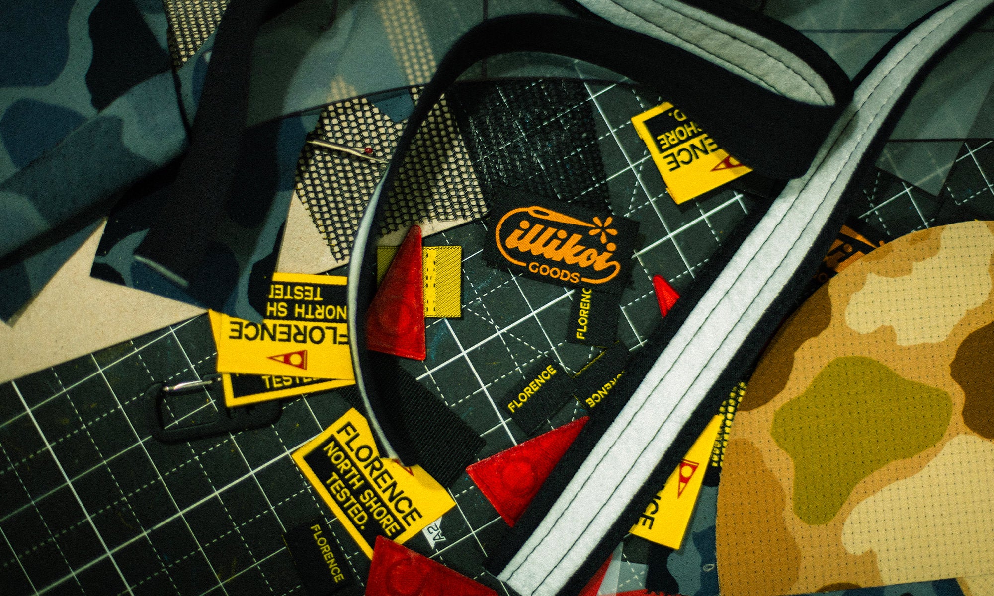 Scraps of fabric. trims, and Florence tags on a creative workstation about to be sewed up