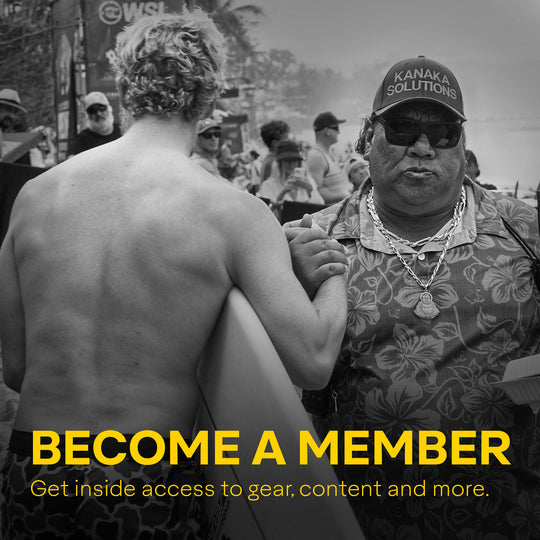Black and white image of two men engaging in a conversation at an outdoor event, with one man facing away and the other wearing a hat with 'KANAKA SOLUTIONS' written on it. The text on the image reads 'BECOME A MEMBER' with additional details about the membership benefits.